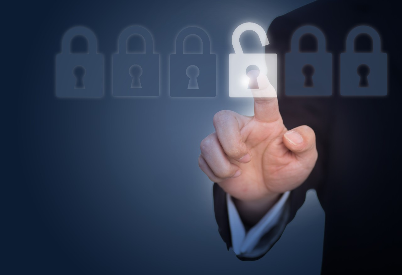businessman unlocking lock on the touch screen 1